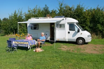 Senior couple with mobil home at campground